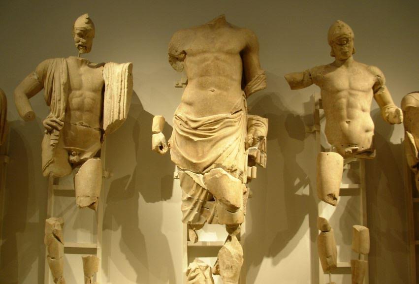 Pelops on East Pediment of Temple of Zeus - Pelops is to Zeus' right, and Oinomaus to the left.