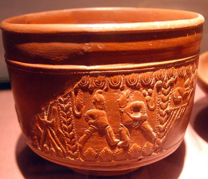 Samian cup 1st cent A.D. - Features gladiatorial combat scenes